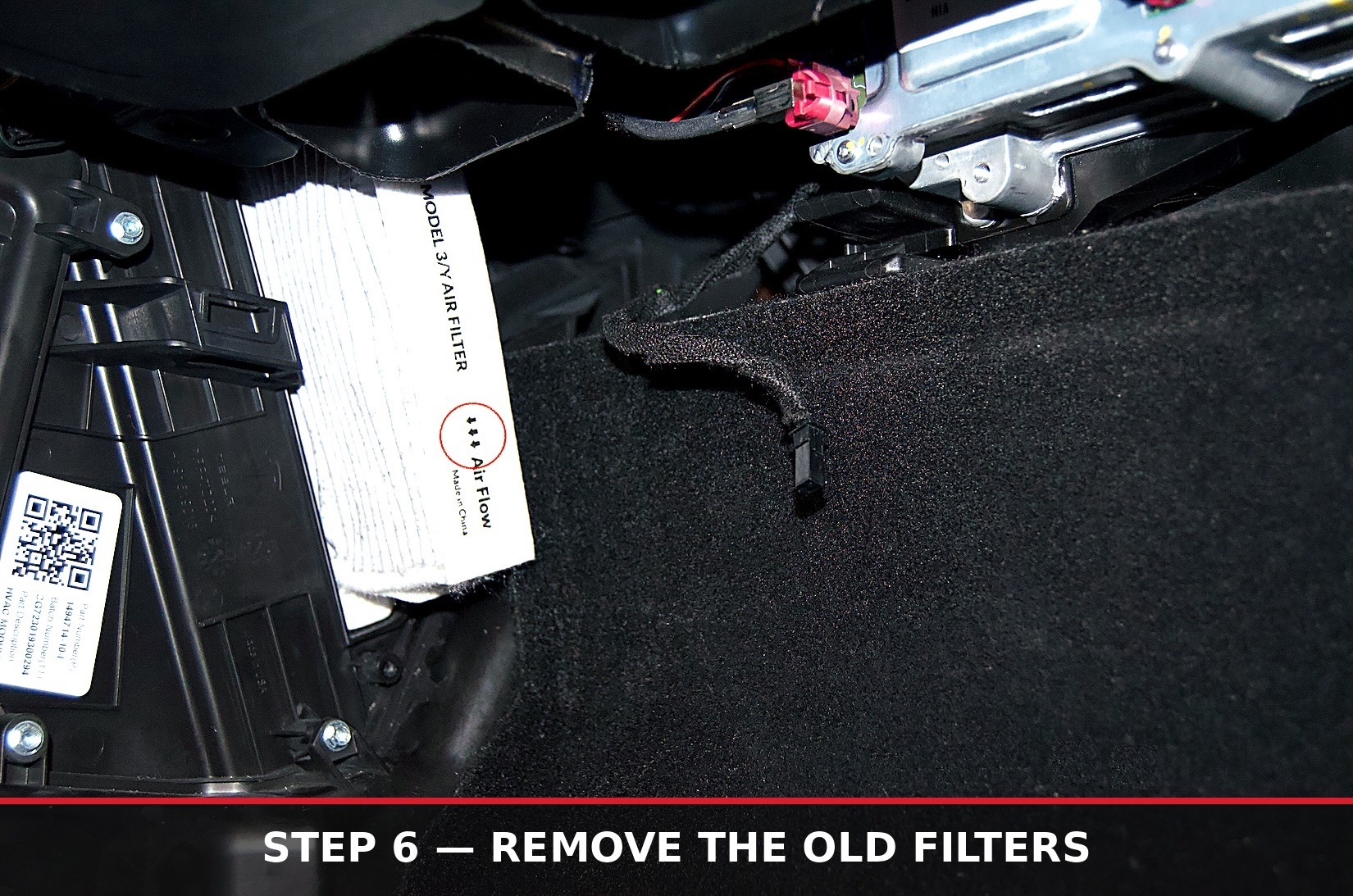 Old cabin air filter partially removed from the housing, airflow arrow circled