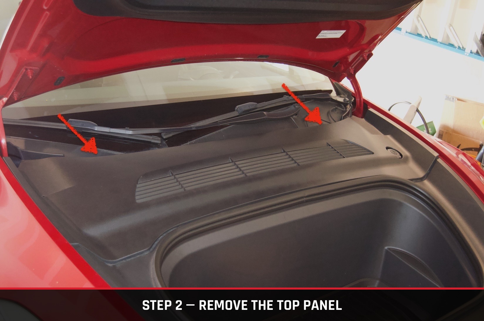 Frunk top panel with arrows marking the clip locations