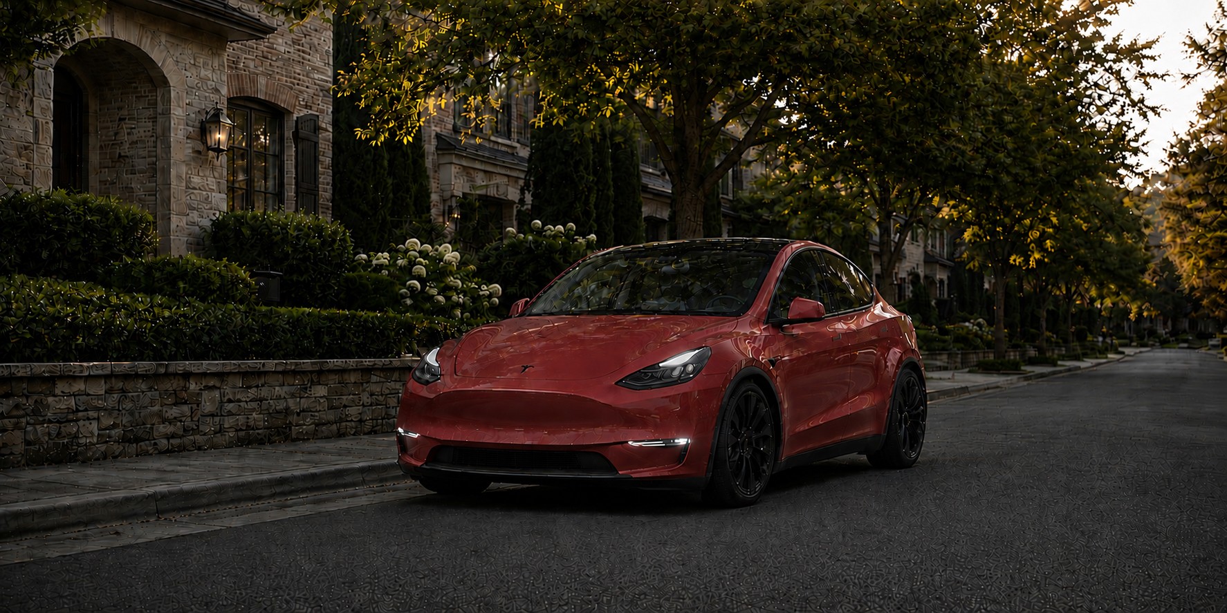 Red Tesla Model Y parked on a tree-lined residential street at golden hour